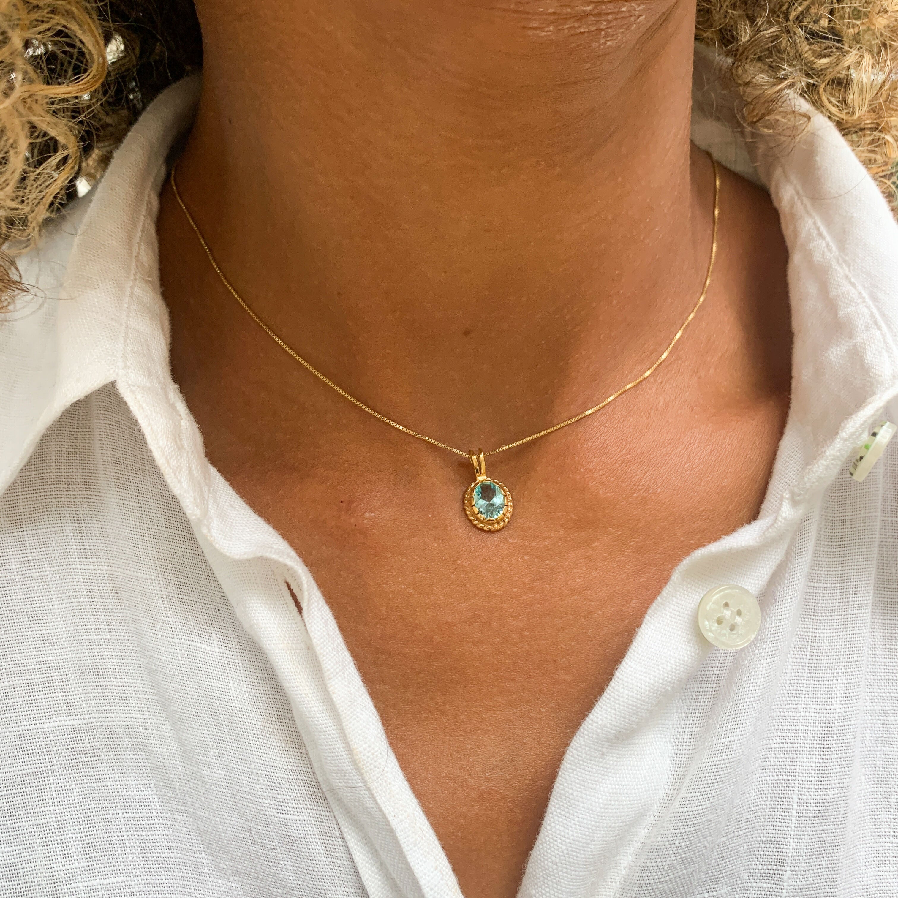 Gold Aquamarine Pendant worn by a model