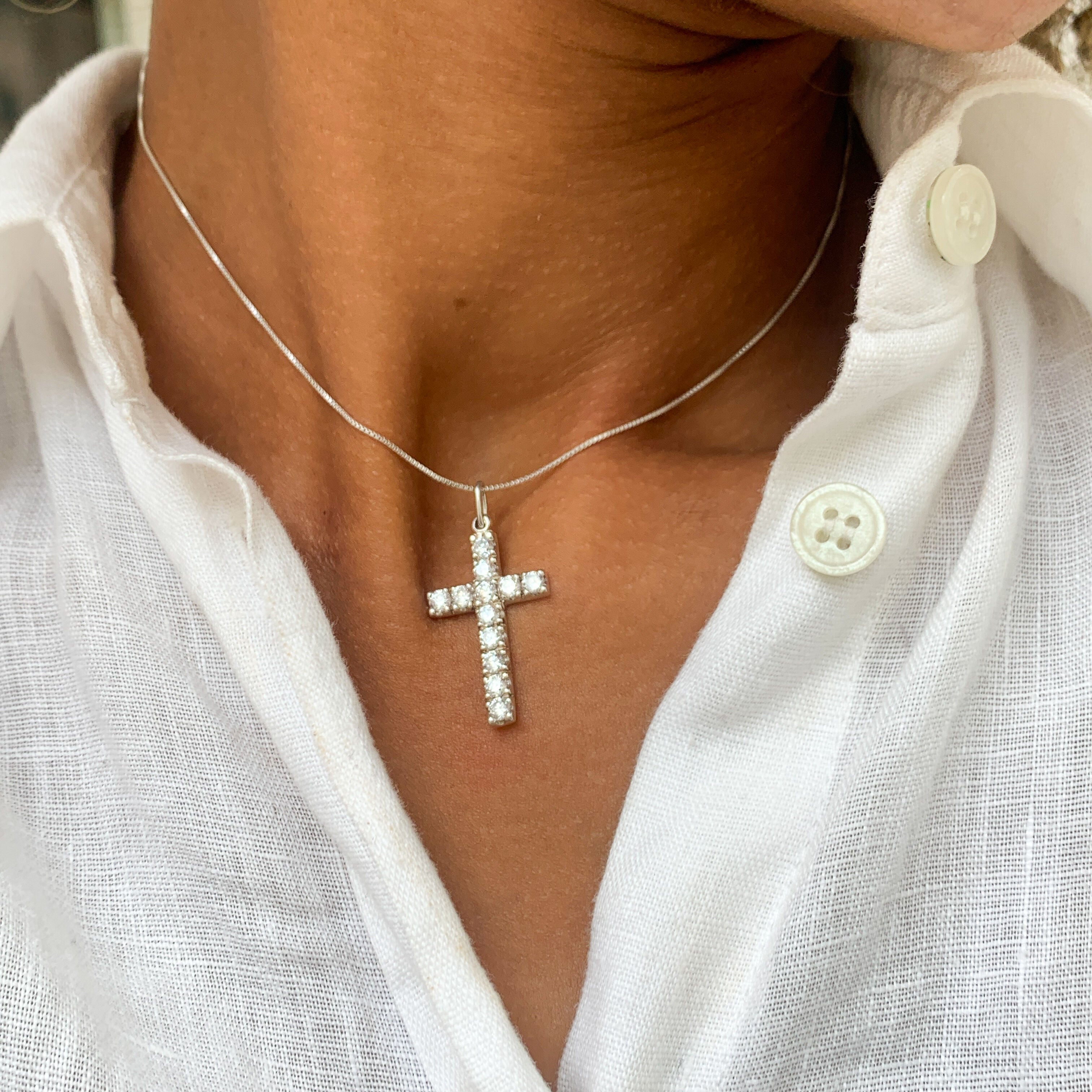 Diamond Cross Necklace worn by a model