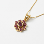 Chic 18k Gold Vermeil Pendant with vibrant red ruby clusters, a meaningful July birthstone gift for passionate individuals.