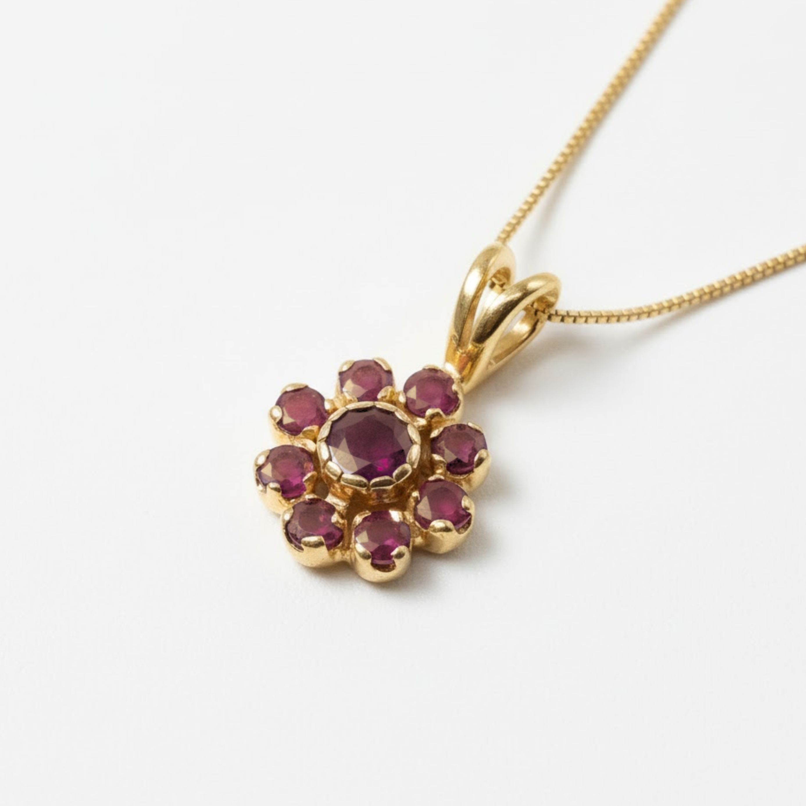Chic 18k Gold Vermeil Pendant with vibrant red ruby clusters, a meaningful July birthstone gift for passionate individuals.