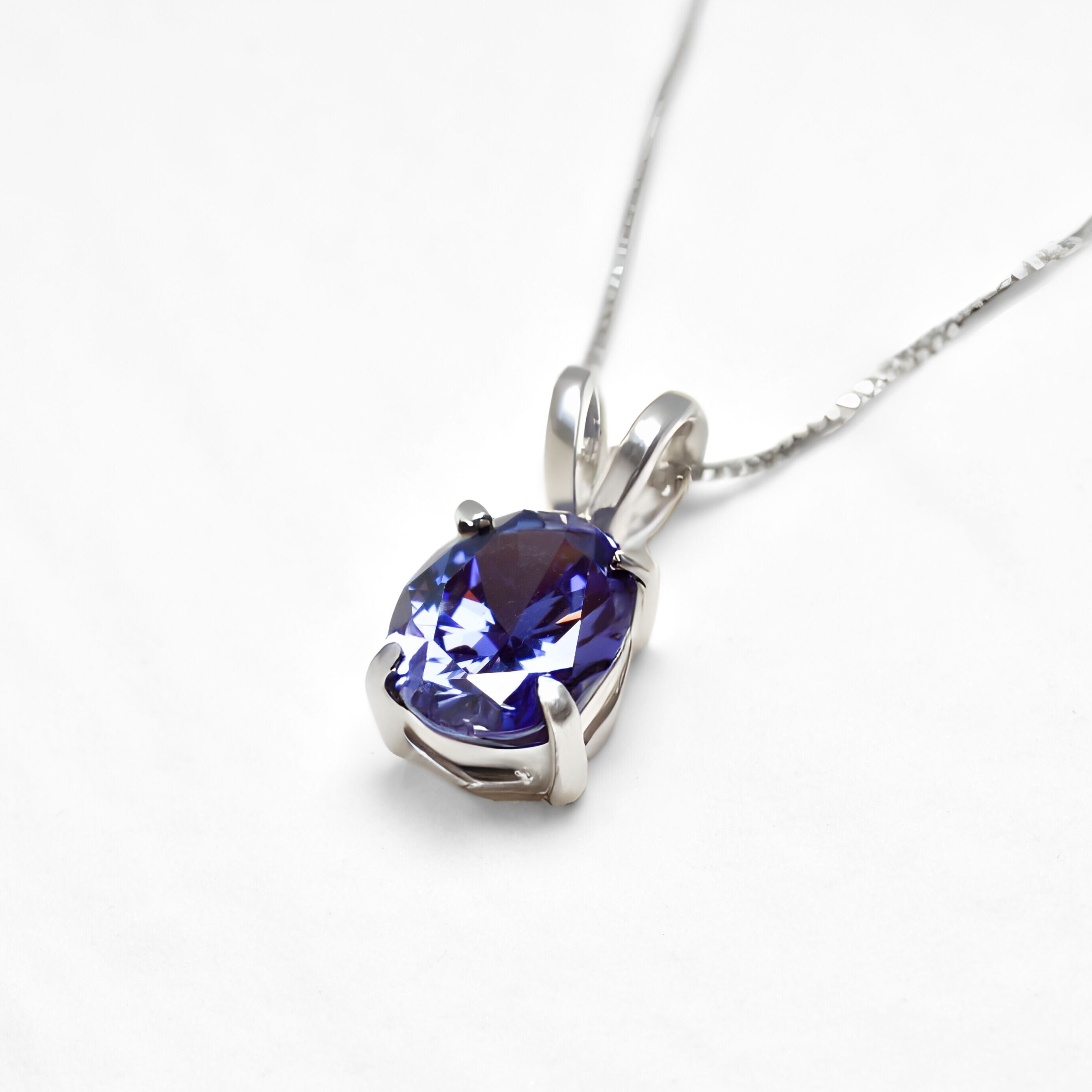 Blue Tanzanite Oval Pendant Angled View in White Background