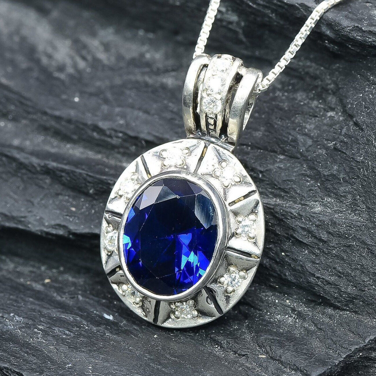 Created Sapphire Pendant made in 925 Sterling Silver with Oval Created Blue Sapphire in Bezel setting, September Birthstone gift idea, symbolizes sincerity, truth, and faithfulness, ideal for everyday wear and perfect for birthday gifting and special occasions.