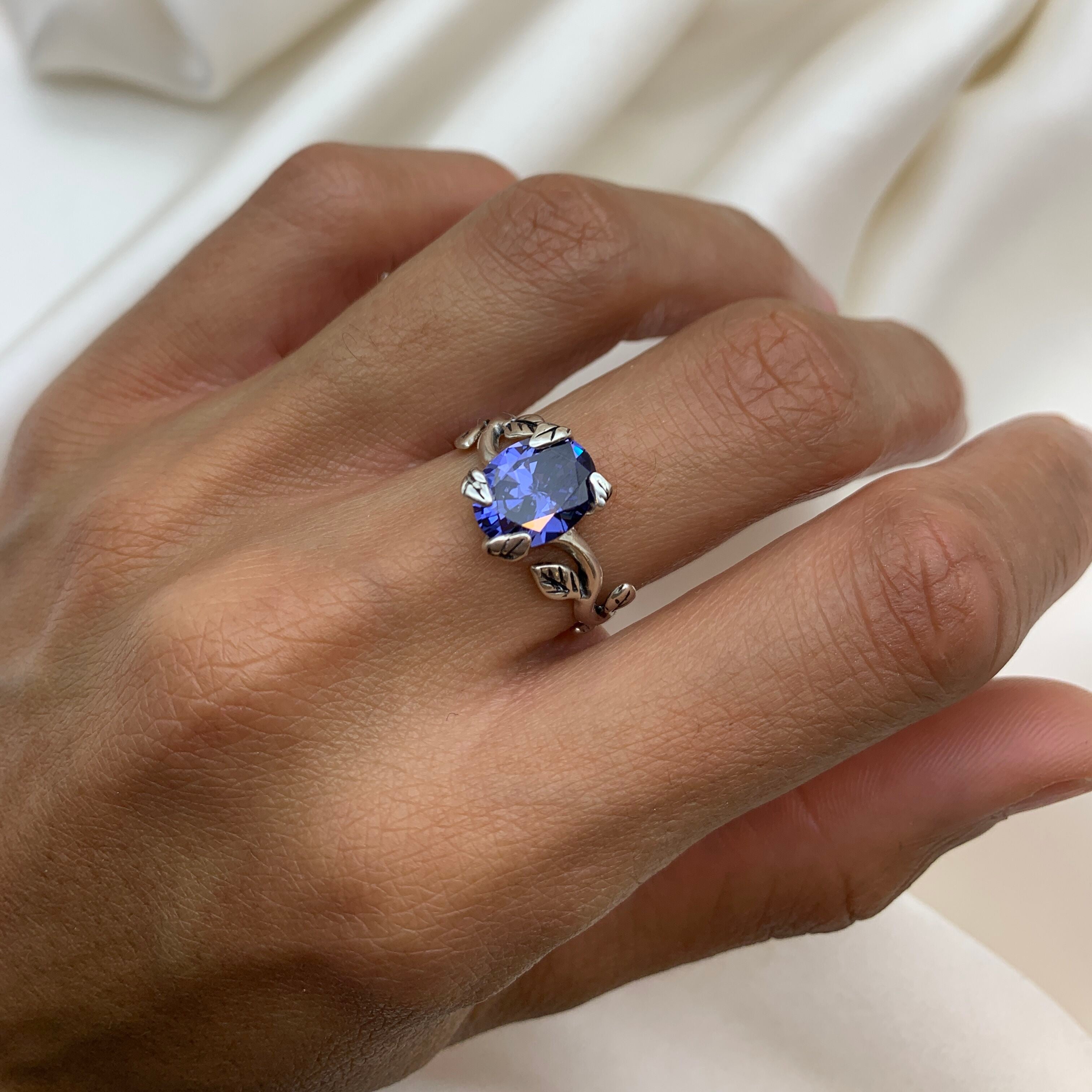 Sterling Silver Ring with Created Tanzanite worn on Middle Finger