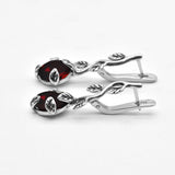 2848-E-nGAR/1: Sterling Silver 925 Garnet 10x8mm Oval