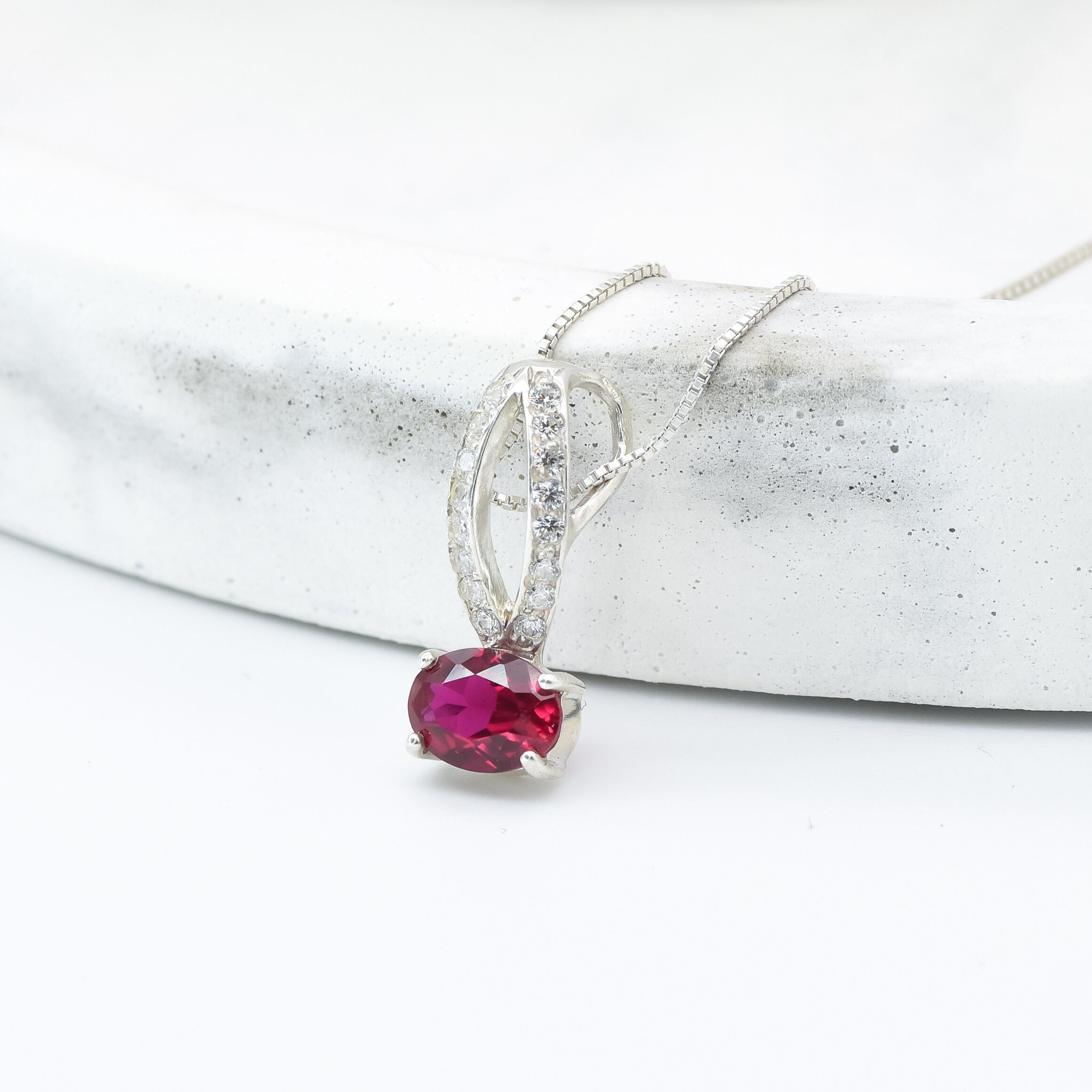 Sterling Silver Ruby Pendant with Oval Created Red Ruby, a perfect July birthstone gift for special occasions and everyday wear.