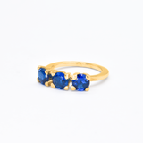 Three-stone created sapphire ring in 18k gold vermeil, a timeless gift symbolizing loyalty and perfect for special moments.