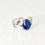Stylish 925 Sterling Silver Ring with a captivating Oval Created Blue Sapphire, an ideal gift for the September-born.