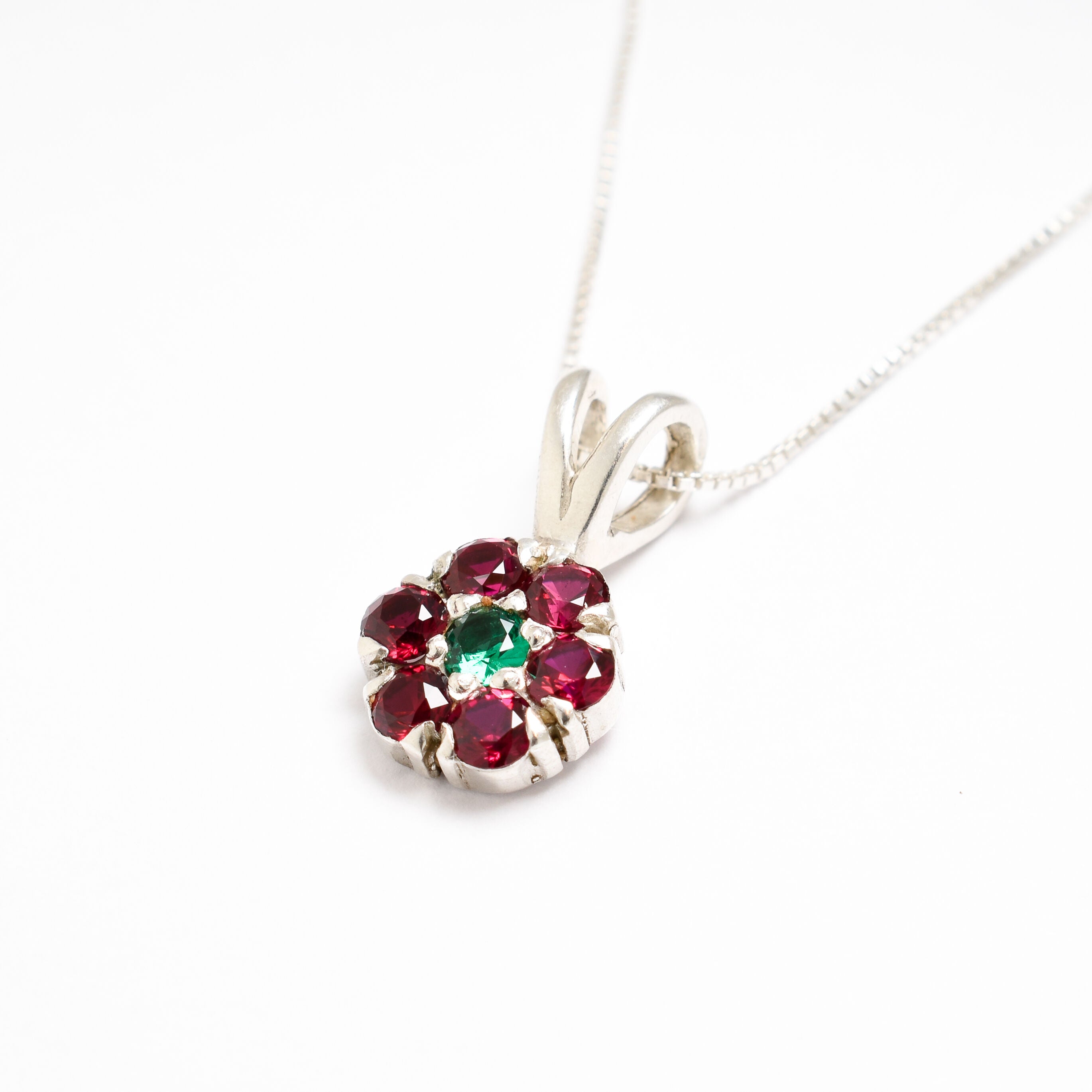 Created Ruby Pendant in 925 Sterling Silver, showcasing a round ruby, perfect for July birthdays and special occasions.