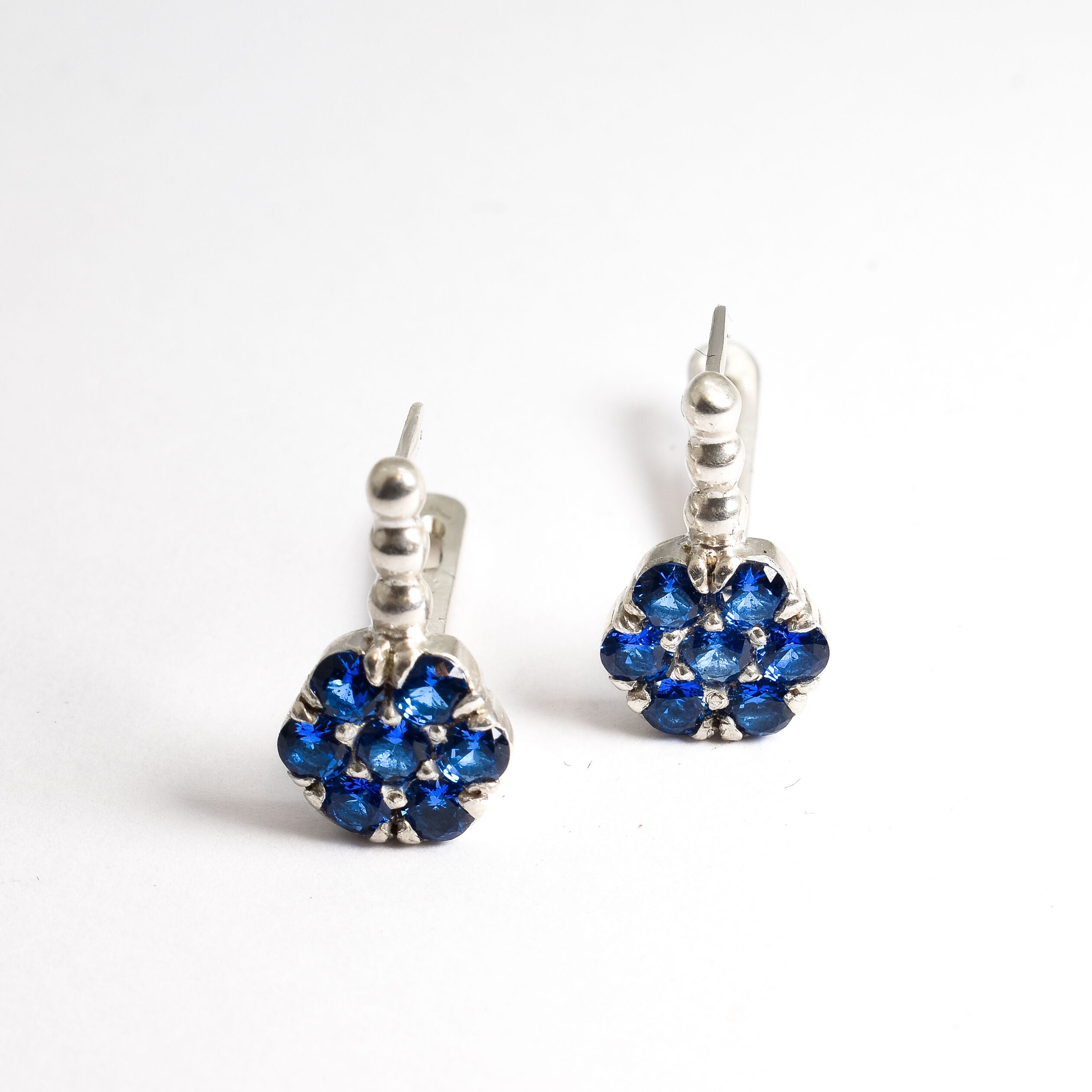 Created Sapphire Earrings made in 925 Sterling Silver with Round Created Blue Sapphire in Cluster setting, September Birthstone gift idea, symbolizes sincerity, truth, and faithfulness, ideal for everyday wear and perfect for birthday gifting and special occasions.