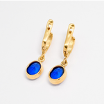 Timeless Sapphire Earrings in 18k Gold Vermeil, showcasing a beautiful Oval Blue Sapphire, perfect for everyday elegance.