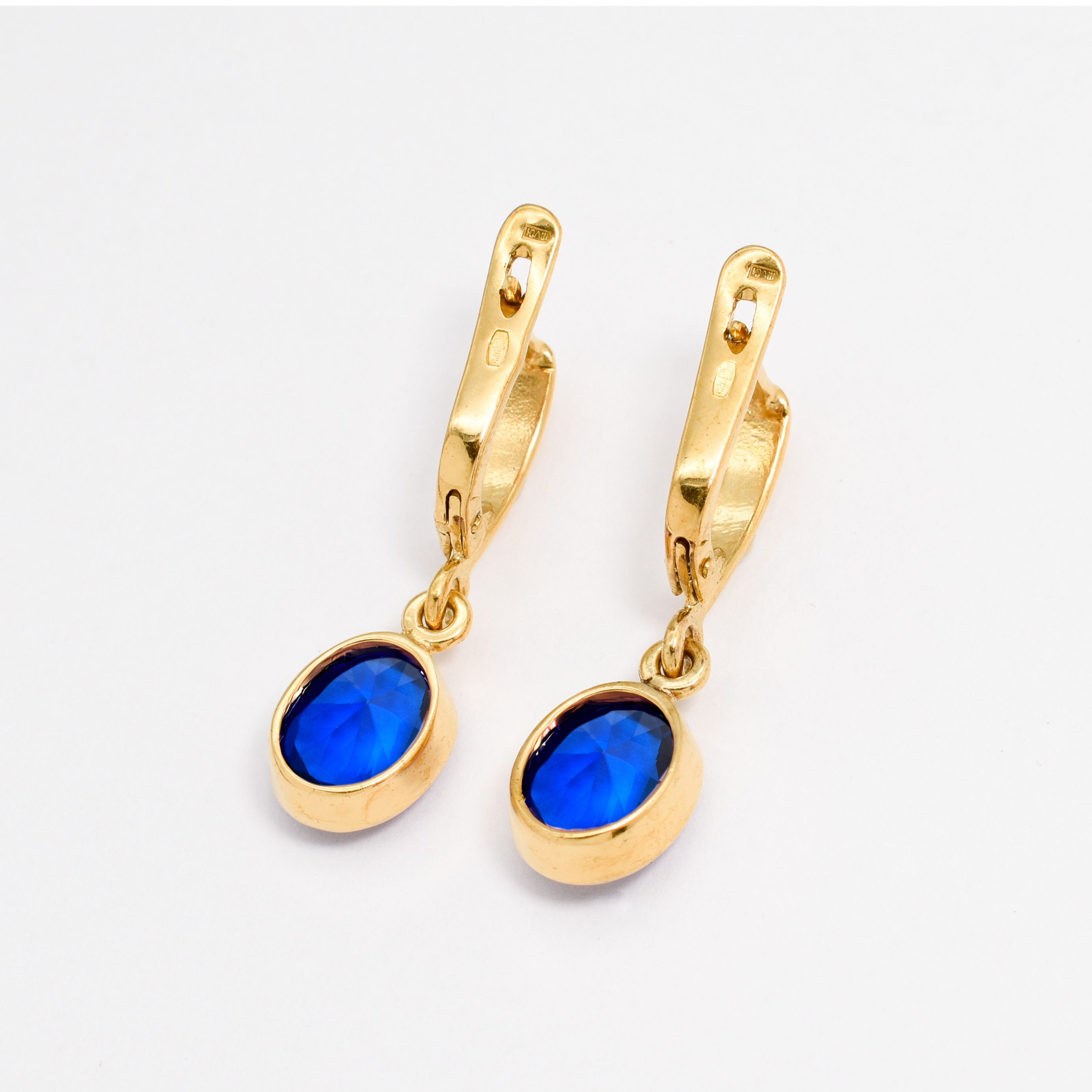 Timeless Sapphire Earrings in 18k Gold Vermeil, showcasing a beautiful Oval Blue Sapphire, perfect for everyday elegance.