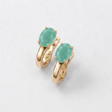 Oval green emerald earrings in 18k gold vermeil, prong-set May birthstone symbolizing growth and harmony.