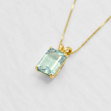 18k gold vermeil pendant with baguette sky blue topaz in prong setting — December birthstone symbolizing clarity & balance