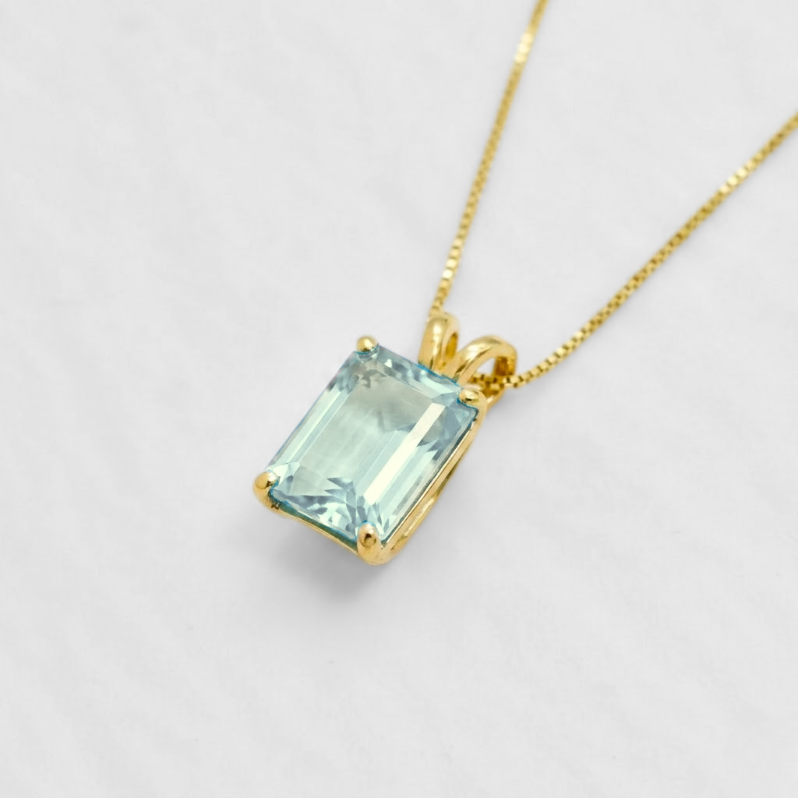 18k gold vermeil pendant with baguette sky blue topaz in prong setting — December birthstone symbolizing clarity & balance