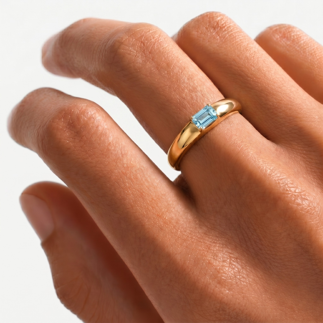 14k yellow gold ring with baguette sky blue topaz in prong setting — December birthstone, elegant everyday birthday gift.