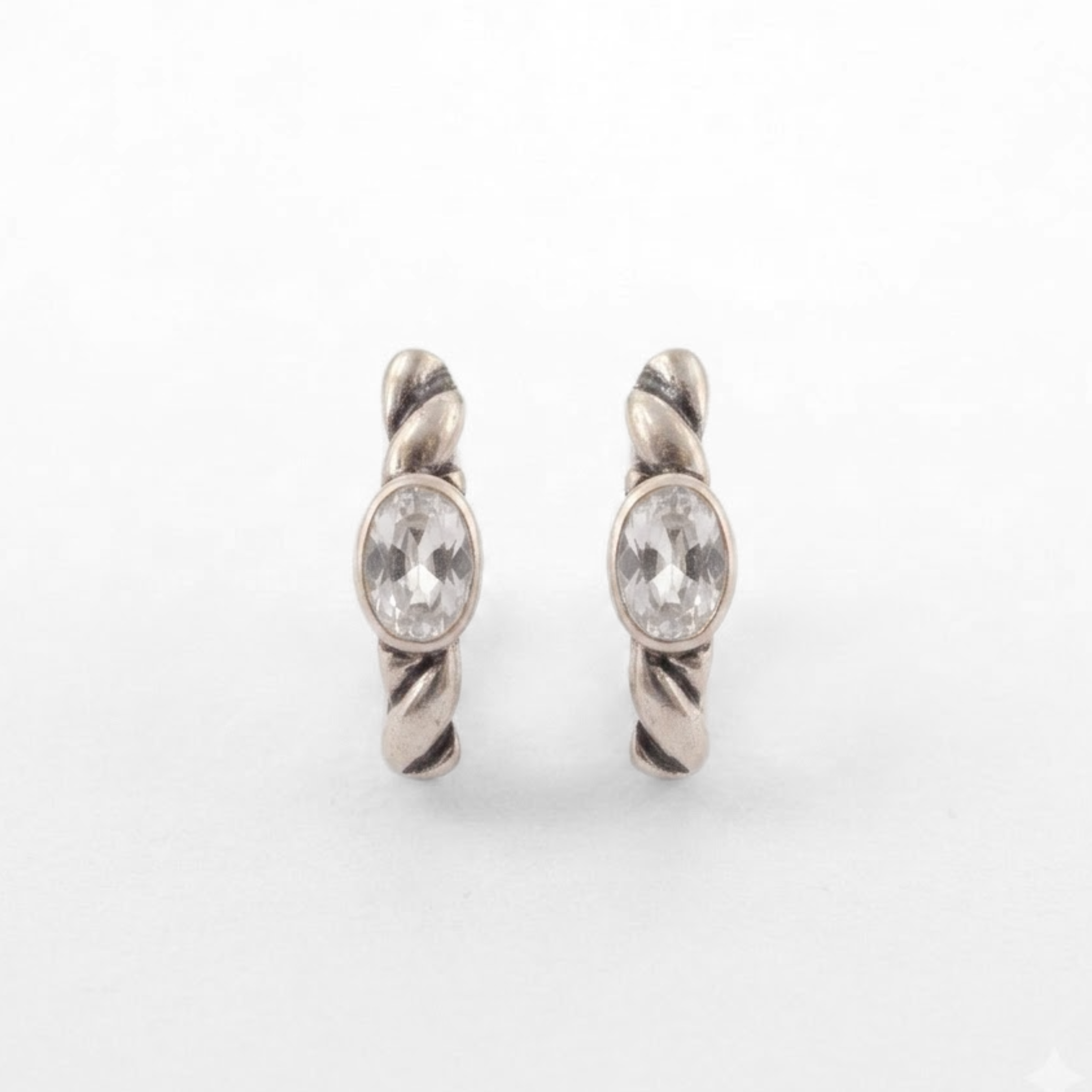 925 sterling silver huggie hoop earrings with clear white topaz, twisted rope texture and bezel-set oval stones, ideal for birthdays, bridal looks and everyday wear; white topaz is associated with clarity and intention.
