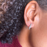 925 sterling silver huggie hoop earrings with clear white topaz, twisted rope texture and bezel-set oval stones, ideal for birthdays, bridal looks and everyday wear; white topaz is associated with clarity and intention.