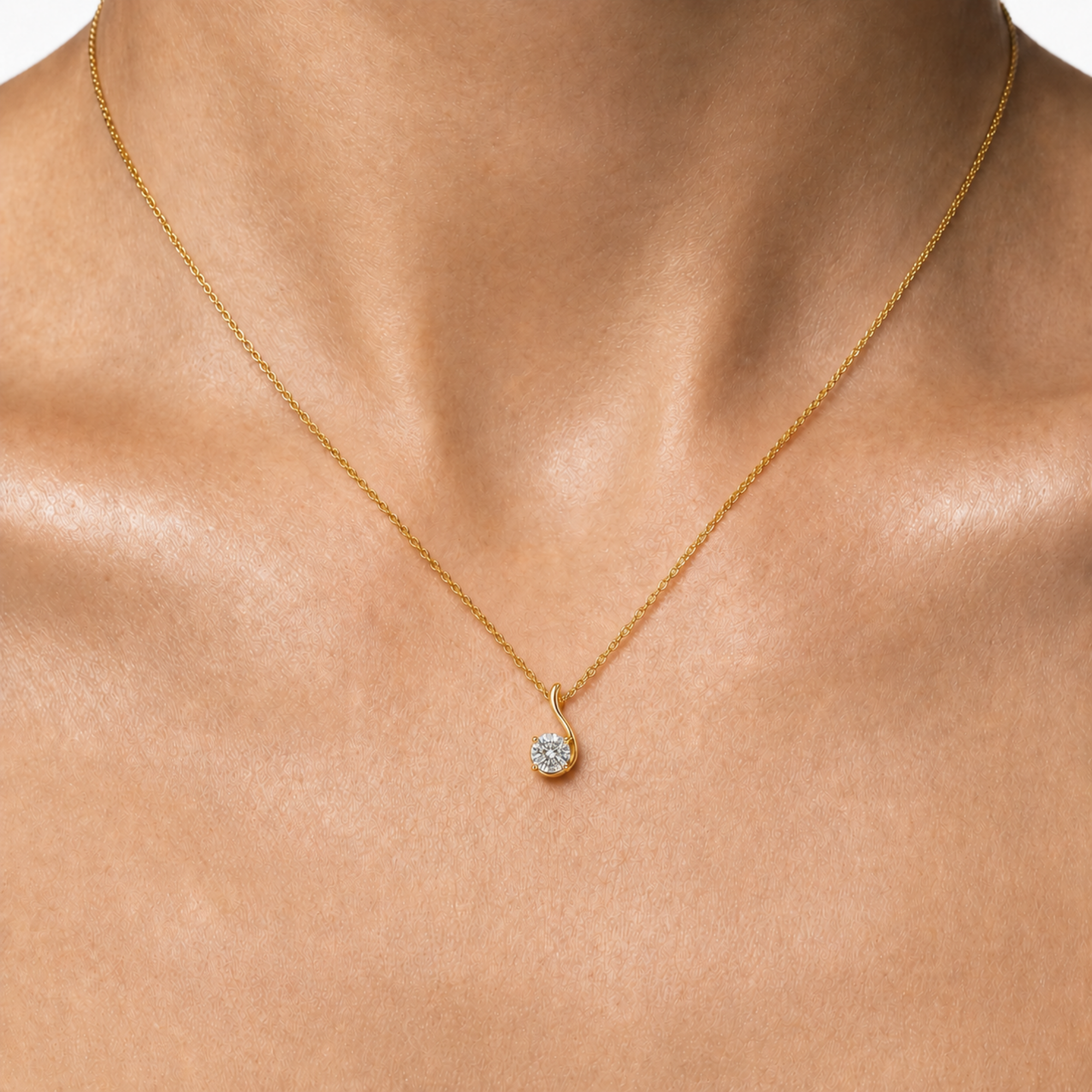 Close-up: natural diamond 14k yellow gold necklace with prong-set April birthstone pendant, elegant everyday gift.