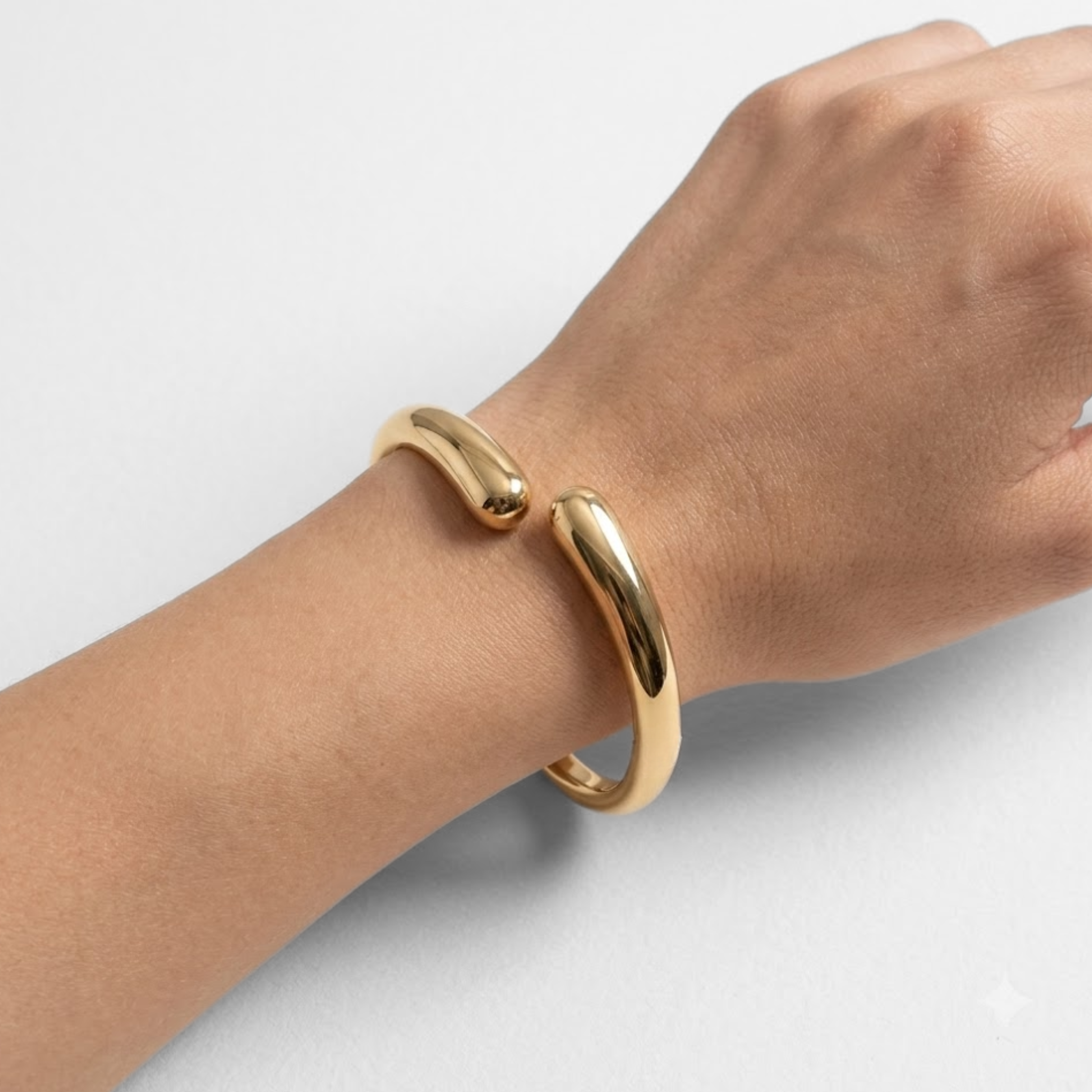 Women’s gold cuff bracelet styled for weddings, anniversaries, date nights and special occasions with a modern minimalist outfit