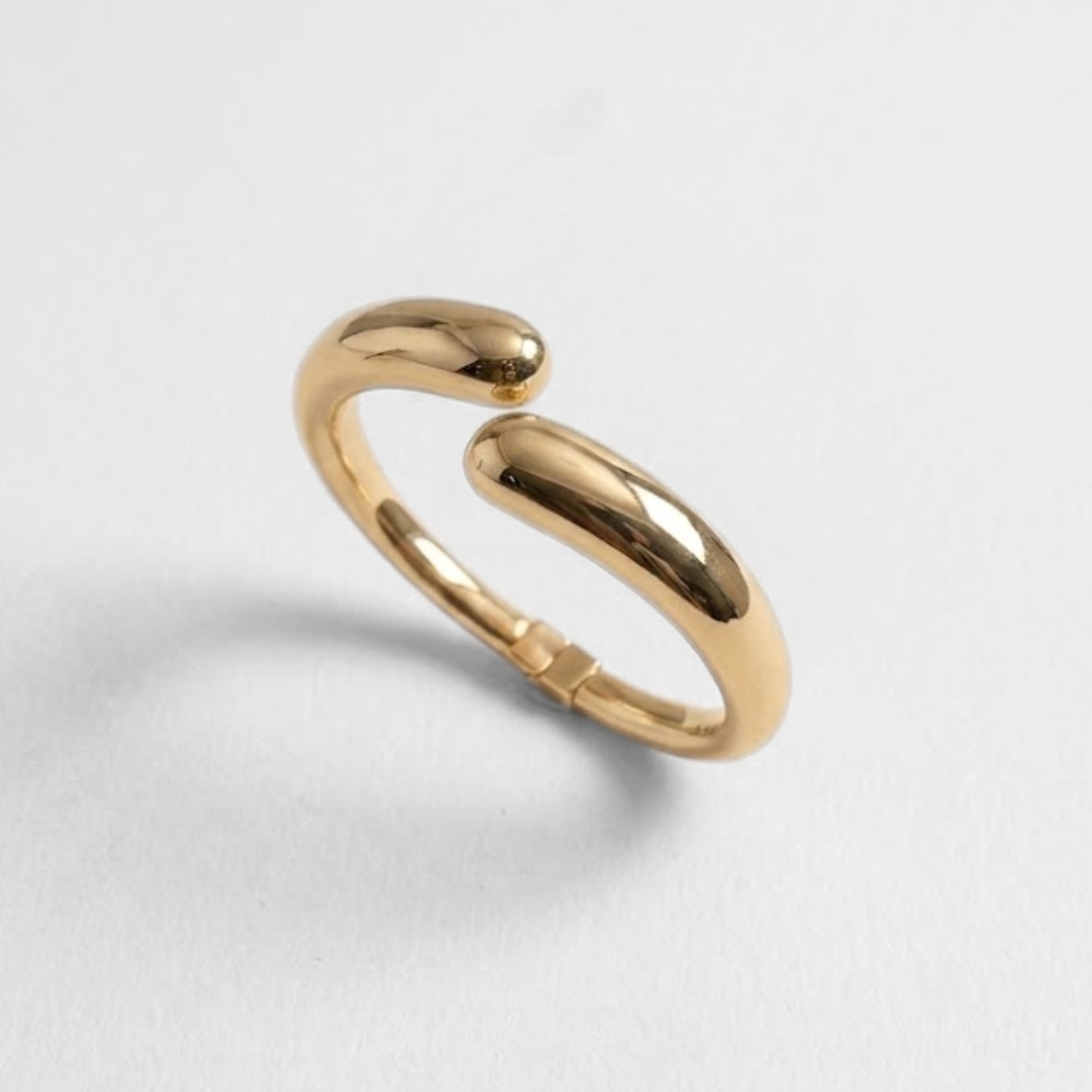Sculptural gold open cuff bracelet with polished dome design, minimalist luxury jewelry for everyday elegance and modern style