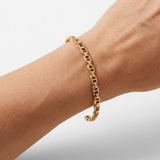 18k gold vermeil mariner anchor link bracelet on wrist — modern everyday jewelry for women, ideal birthday gift.