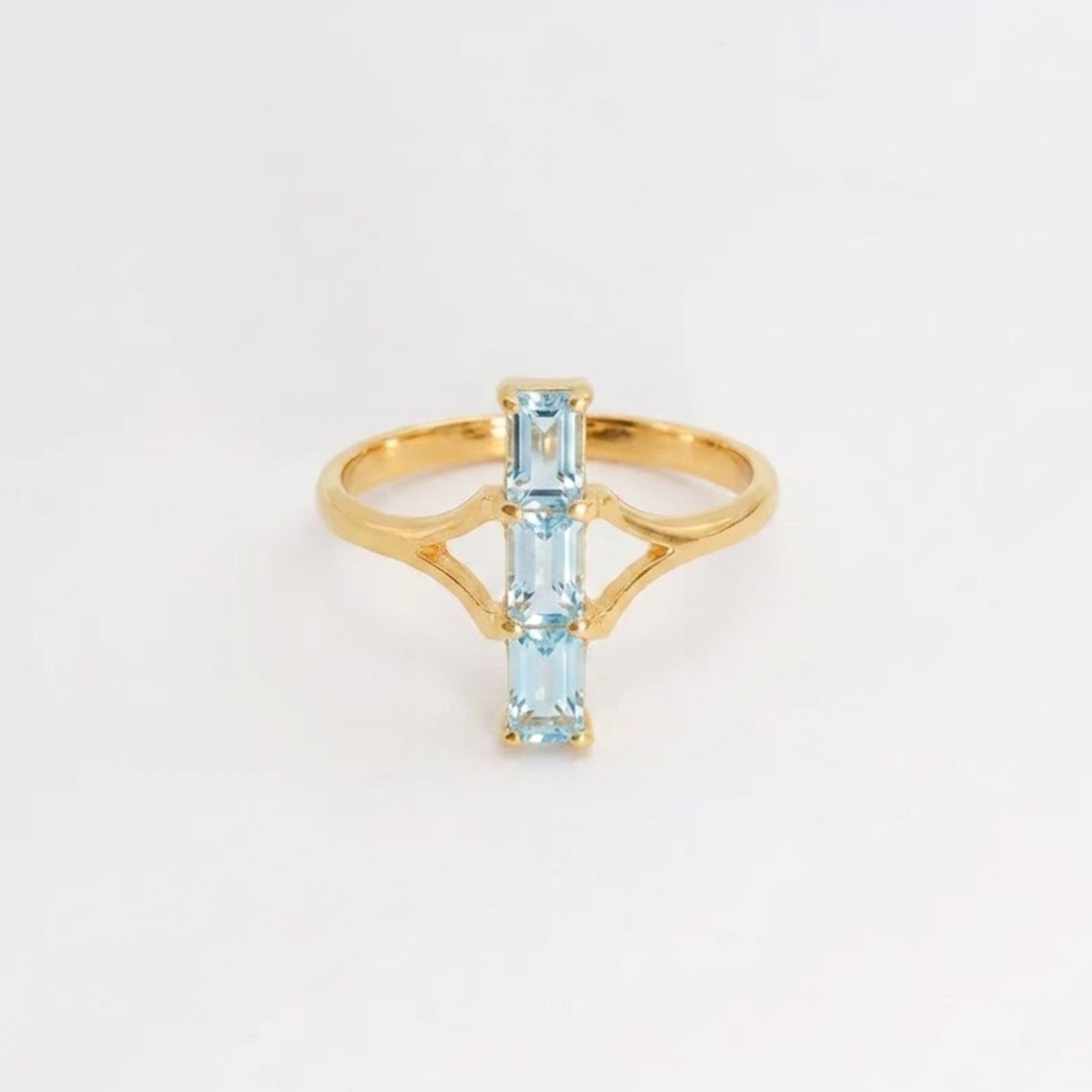 Sky-blue topaz ring, 18k gold vermeil prong setting — December birthstone; symbolizes clarity and emotional balance.