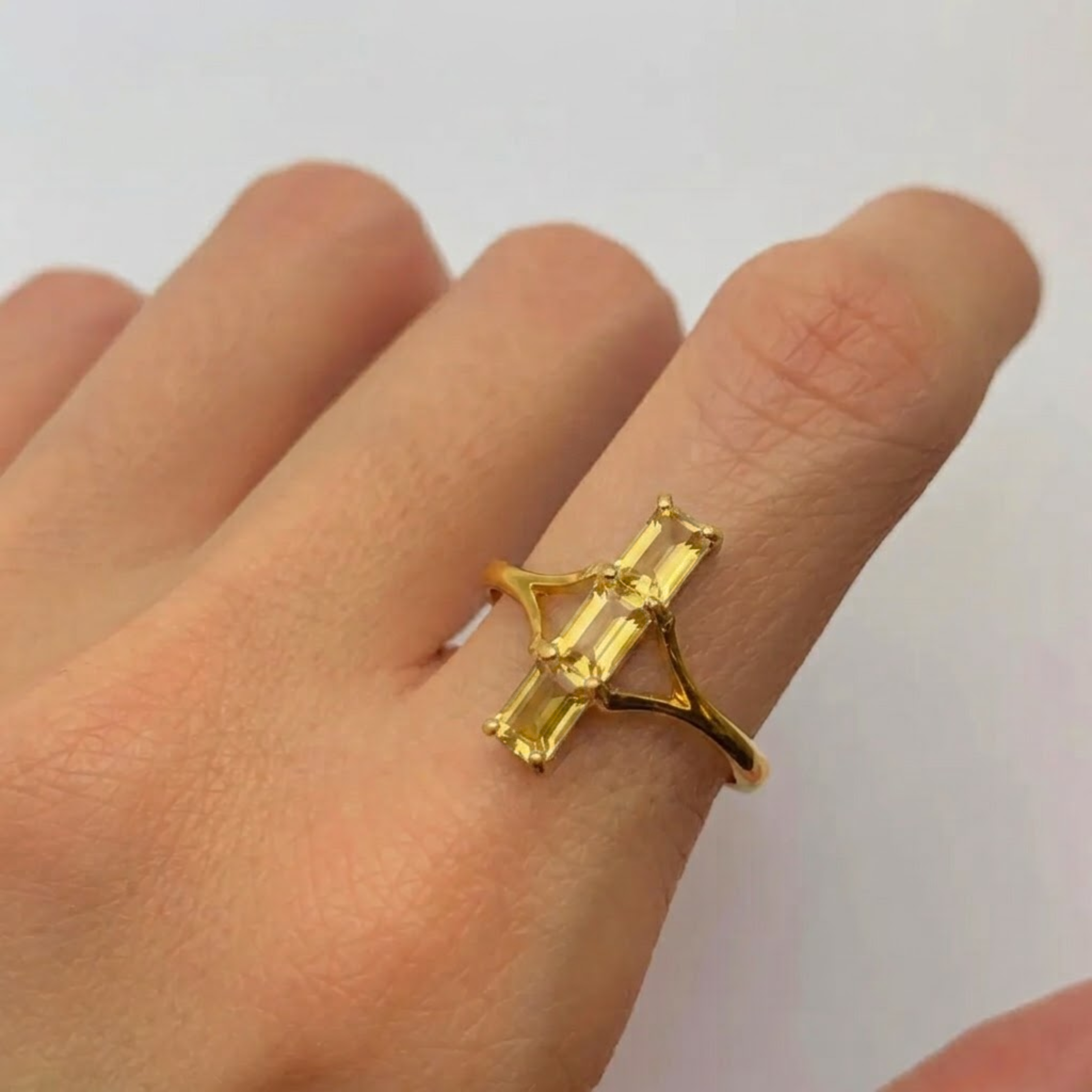 Close-up of 18k gold vermeil ring with natural yellow citrine in prong setting, November birthstone gift