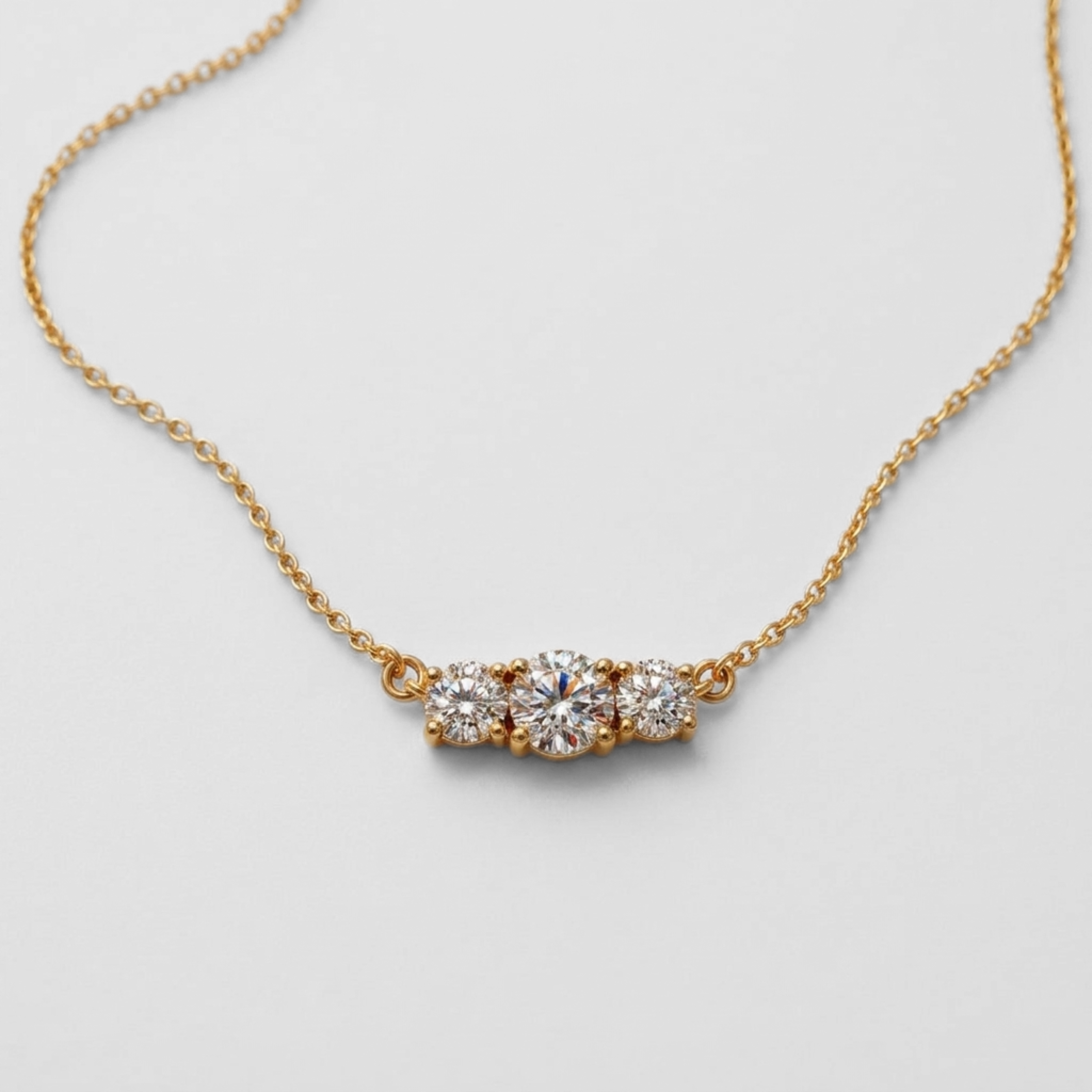 14k yellow gold necklace with natural white diamond in prong setting, April birthstone symbolizing commitment and purity.
