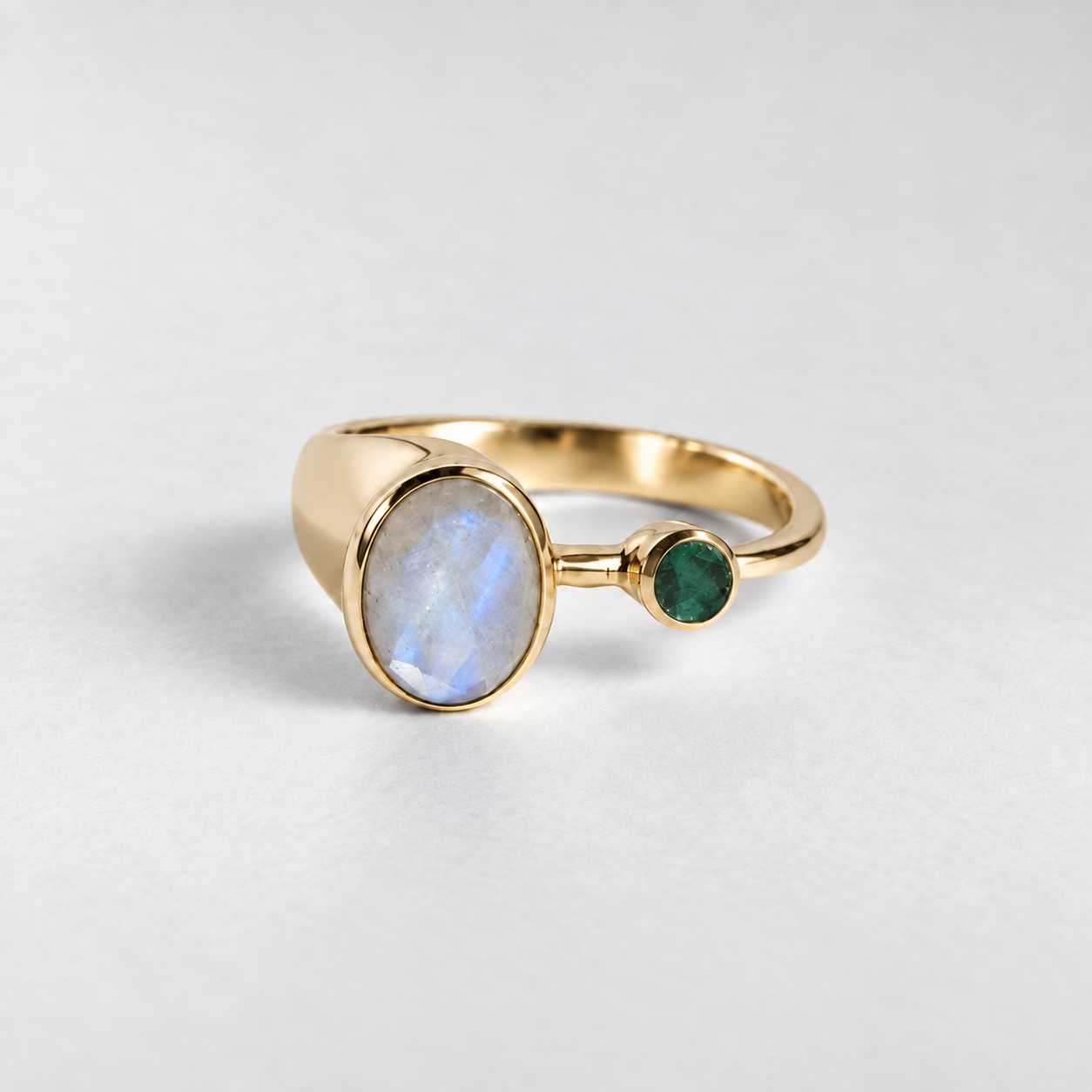 Oval rainbow moonstone set in 18k gold vermeil bezel, symbolizing hope and protection, ideal for birthday or everyday wear.