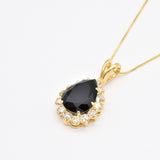 This Onyx Pendant features a 9 Ct stone with golden brilliance for timeless appeal.