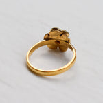 Vintage Fire Opal flower ring with a rose inspired artisan design in gold. The daisy style petals frame a round opal center for a floral and feminine look. Opal is believed to bring hope, creativity and emotional balance, making it a meaningful October birthstone gift. Perfect for weddings, anniversaries, special celebrations and romantic events.