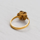 Vintage Fire Opal flower ring with a rose inspired artisan design in gold. The daisy style petals frame a round opal center for a floral and feminine look. Opal is believed to bring hope, creativity and emotional balance, making it a meaningful October birthstone gift. Perfect for weddings, anniversaries, special celebrations and romantic events.