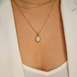 Calming opal necklace believed to inspire hope and emotional healing benefits.