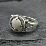 Australian Opal Ring in sterling silver featuring a round cabochon cut opal with flashes of fire colors. Australian opal is linked to creativity, inspiration, and emotional balance, making it a meaningful October birthstone gift. A thoughtful choice for birthdays, anniversaries, engagements, or promise rings. Perfect for daily wear, weddings, and elegant evening occasions.