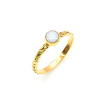 Bezel Opal ring with engraved gold band in a tribal boho style. The opal displays fire colors and flashing rainbow tones, symbolizing hope, creativity and emotional balance. A unique October birthstone gift perfect for anniversaries, festivals, weddings and special celebrations.