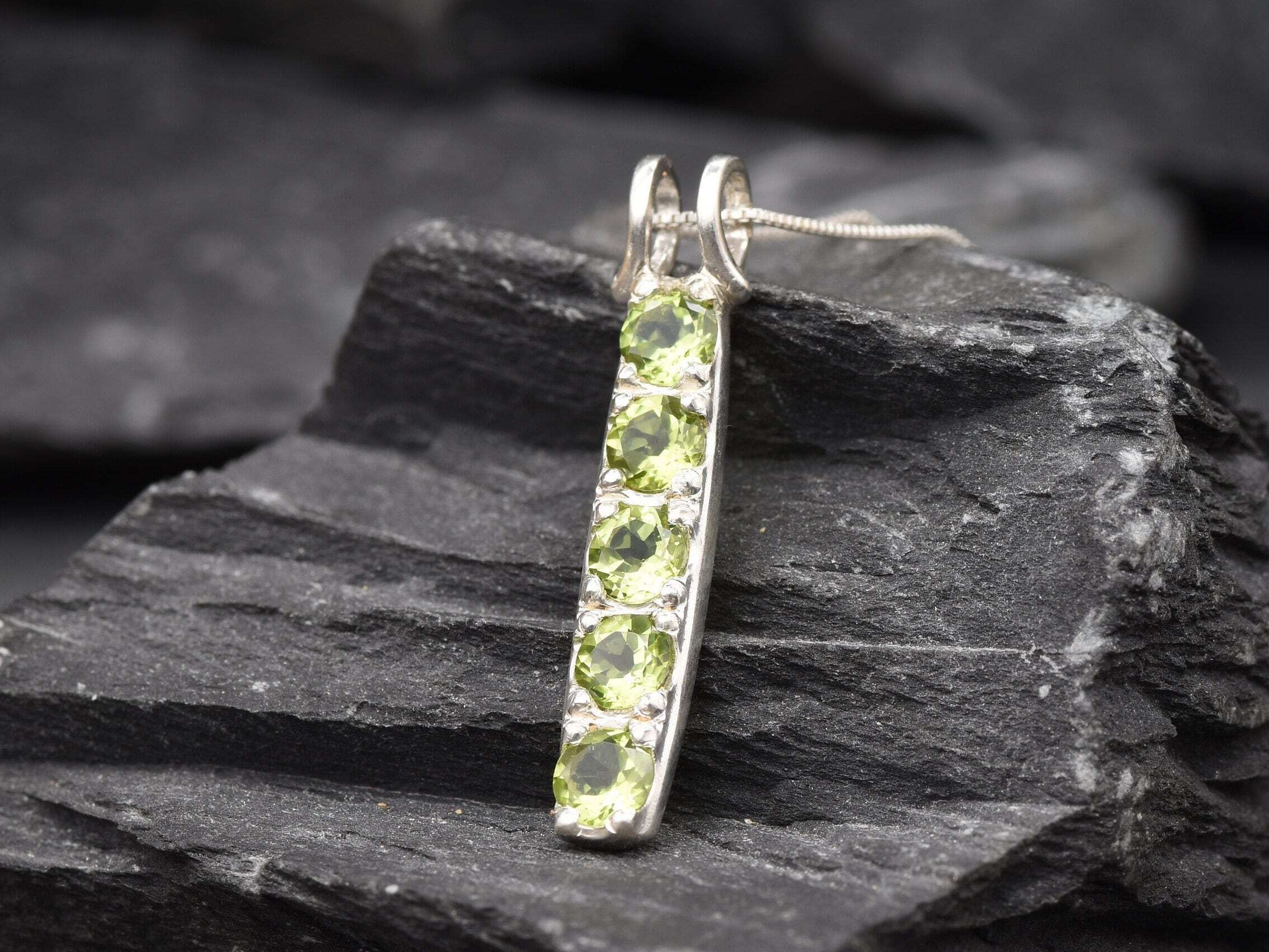 Peridot birthstone pendant necklace, perfect for personalized gift ideas during special celebrations.