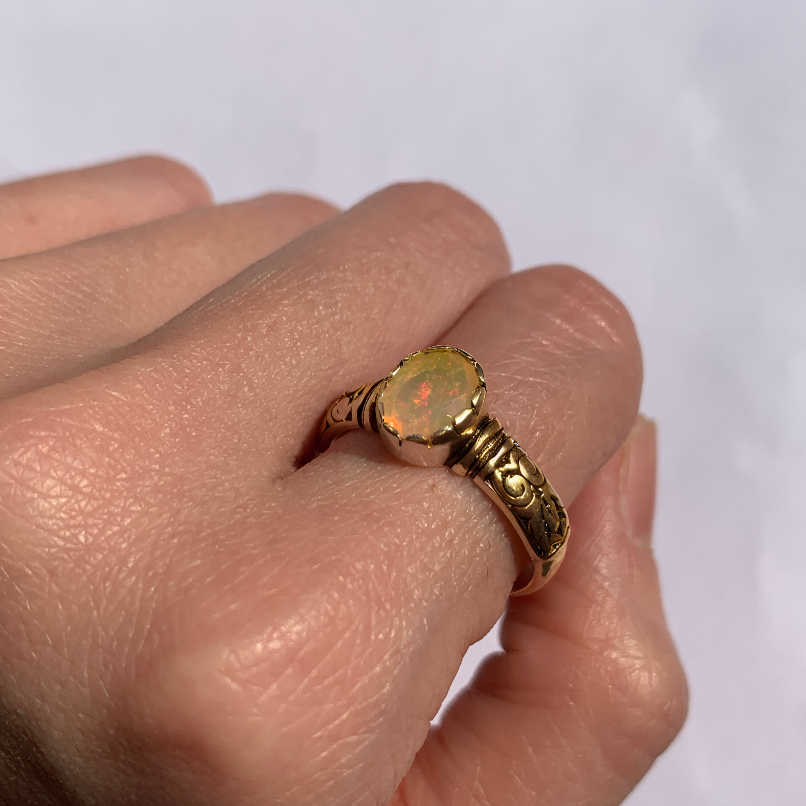 Ethiopian Opal October Birthstone Ring with tribal boho engraved gold band featuring flashes of fire colors, designed for artistic style and uplifting positive energy. A meaningful October Birthstone gift symbolizing hope, balance, and creativity. Perfect for birthdays, anniversaries, weddings, festivals, and evening celebrations.