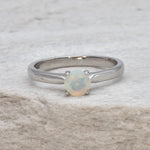 Natural Fire Opal solitaire ring set in 18k solid white gold, a timeless jewelry piece symbolizing creativity and passion, the perfect October birthstone gift for anniversaries, engagements, or milestone celebrations.