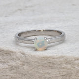 Natural Fire Opal solitaire ring set in 18k solid white gold, a timeless jewelry piece symbolizing creativity and passion, the perfect October birthstone gift for anniversaries, engagements, or milestone celebrations.