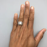 Classic Australian Opal Ring worn on hand with bare nails. Features a round cabochon opal with subtle flashes of fire colors set in sterling silver. A timeless October birthstone ring ideal for promise or engagement gifts, best worn at formal events, anniversaries, and special celebrations.