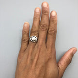 Classic Australian Opal Ring worn on hand with bare nails. Features a round cabochon opal with subtle flashes of fire colors set in sterling silver. A timeless October birthstone ring ideal for promise or engagement gifts, best worn at formal events, anniversaries, and special celebrations.