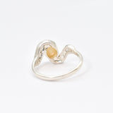 Fire Opal bezel wave ring with CZ pave in sterling silver, featuring flashes of rainbow fire colors, designed in a dainty jewelry style symbolizing passion and hope, a powerful October birthstone gift idea for engagements, anniversaries, and special occasions.