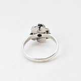 Natural Opal Flower design set in sterling silver ring offering timeless elegance and calming energy perfect as an October birthstone gift for birthdays anniversaries or romantic proposals.