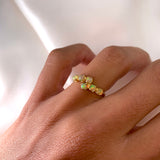 Dainty Opal Six Stone Ring worn on ring finger, featuring a vintage bypass gold setting. Perfect for bringing inspiration and emotional balance, ideal for October birthdays, anniversaries and romantic dinners.