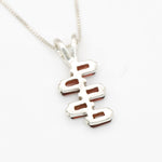 Garnet pendant in sterling silver with geometric arrangement for flair