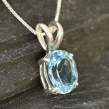 Blue Topaz pendant reflecting clarity and sparkle in sterling silver setting