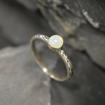 White Opal Bezel Ring with engraved tribal inspired silver band. The dainty minimalist design highlights the gemstone with flashes of color, making it both elegant and unique. Opal is known to bring inspiration, harmony, and emotional balance. A thoughtful promise ring or October birthstone gift for birthdays, anniversaries, and special milestones. Perfect to wear daily or for boho chic events, weddings, and family gatherings.