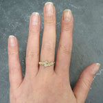 Ethiopian Fire Opal Bypass Ring with cabochon gems worn on middle finger with natural nails, radiating flashes of fire colors, styled with minimalistic outfits, perfect for office gatherings, cocktail parties, and wedding receptions.