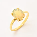 Natural Fire Opal solitaire design in yellow gold setting radiating warmth and positivity perfect as an October birthstone gift for engagements anniversaries, promise ring or milestone celebrations.