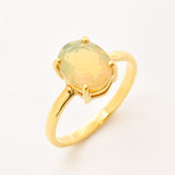 Natural Fire Opal solitaire design in yellow gold setting radiating warmth and positivity perfect as an October birthstone gift for engagements anniversaries, promise ring or milestone celebrations.